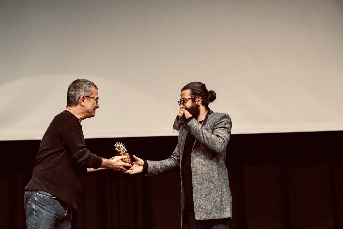 Milad Mansouri receiving his award at the International Istanbul National Film Festival (IINFF)