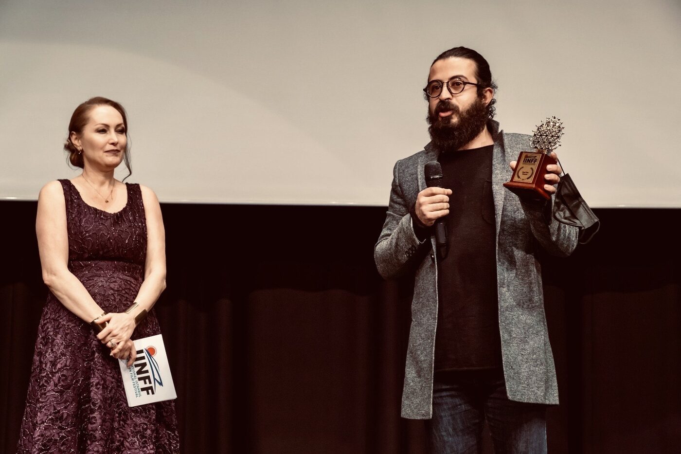 Milad Mansouri receiving his award at the International Istanbul National Film Festival (IINFF)